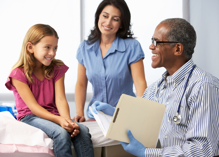 Parent and patient with doctor